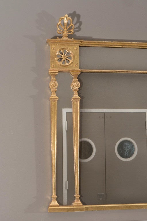 From an unknown commission approximately from the 1770s or 1780s designed by Robert Adam. A contemporary mirror frame made using traditional techniques by Ossowski, dealers in fine 18th century mirror, through a partnership with the Sir John Soane