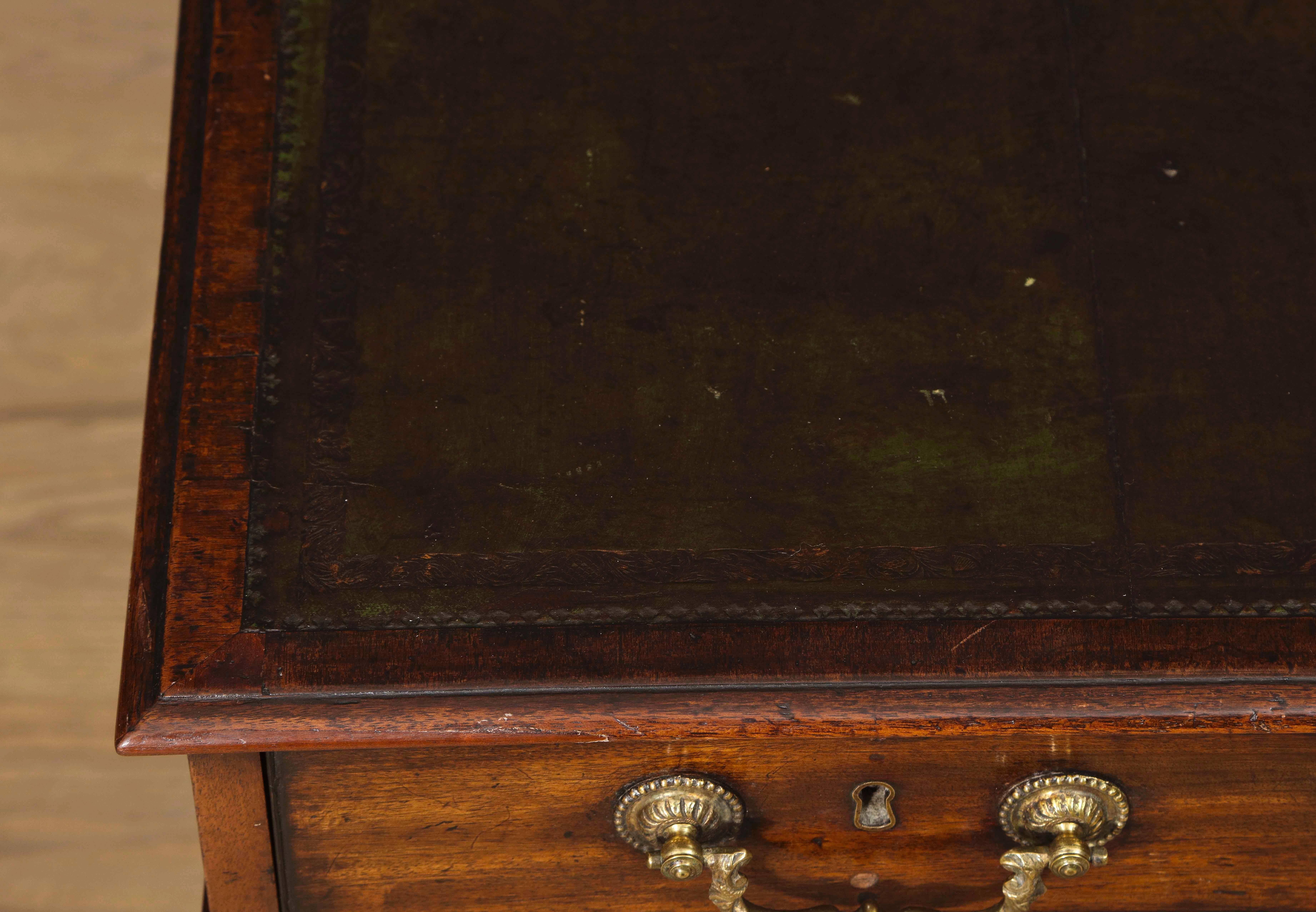 Excellent Mahogany Chippendale Partners Desk with four sets of covered drawers retaining their original fire gilt pulls. Previously in the collection of Eileen Ford. Possibly from a suite of furniture made for Paxton House.