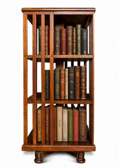 Arts & Crafts Three Tier Open Frame Revolving Bookcase With Slatted Sections