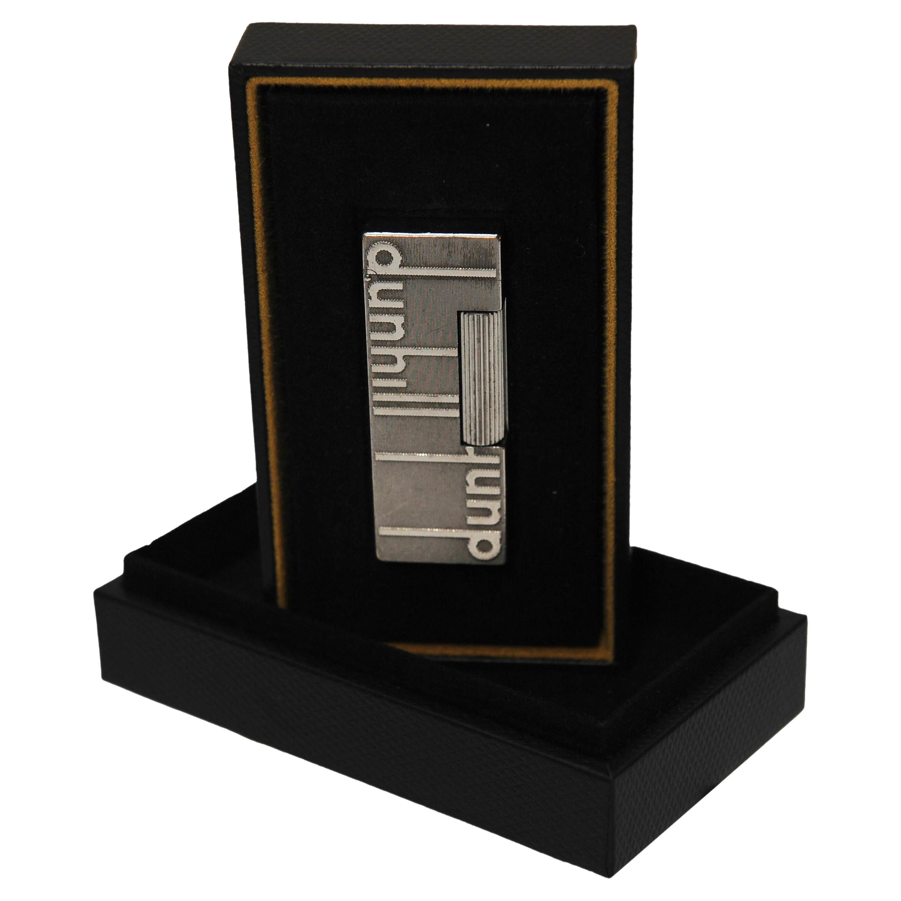 An Original Dunhill of London Longtail Logo Rollgas Cigarette Lighter With Guarantee Card and Original Dunhill Presentation Box.
Ideal Father's day, Christmas present etc

Inspired by the dunhill archive, a palladium-plated brass lighter featuring