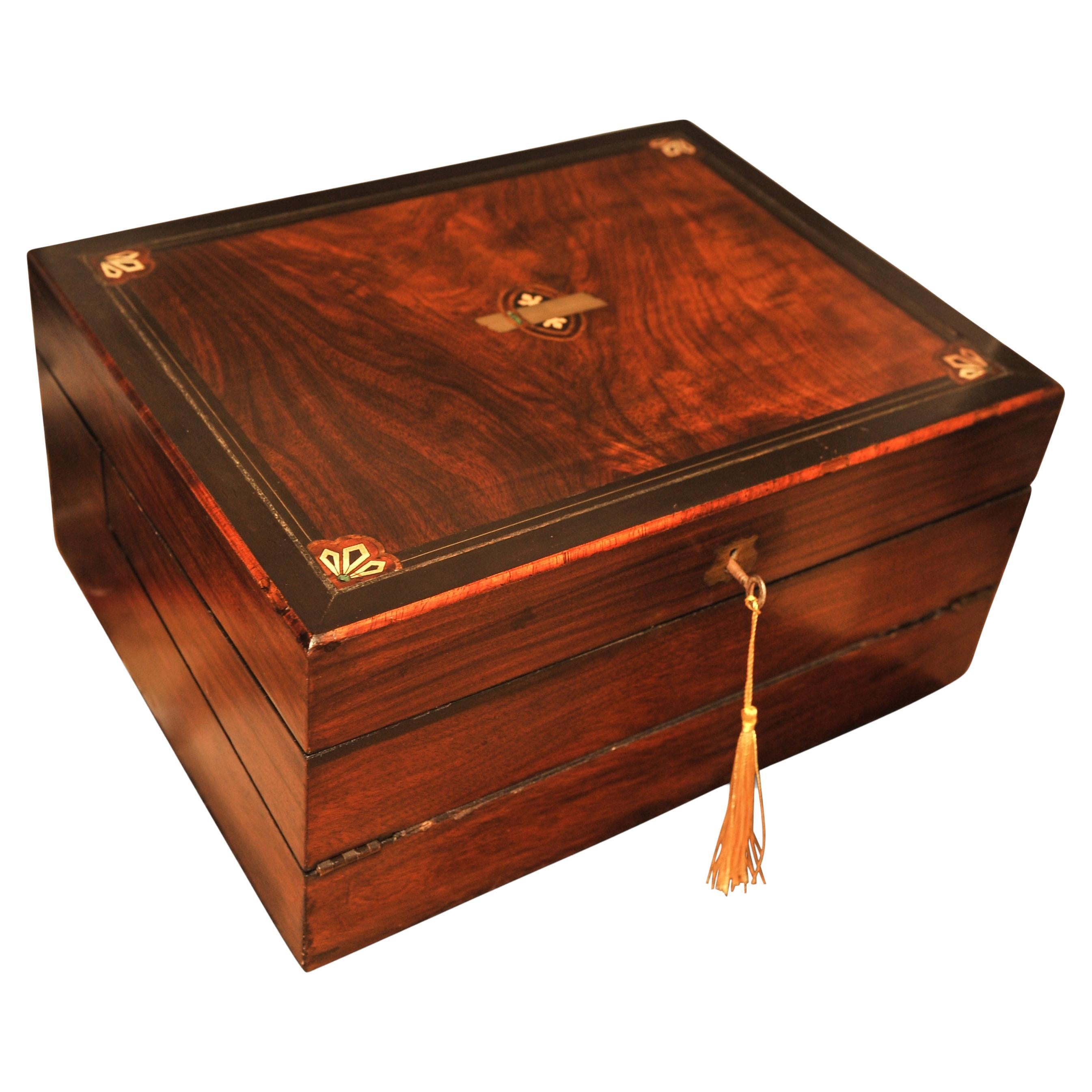 Elegant 19th Century Victorian Flame Mahogany Decorative Inlaid Writing Slope With Black Ebonised Accents & Fitted Stationary Compartments With A Tooled Leather Interior 

Supplied with two glass inkwells 
A new notepad 
A vintage ink pen 
A Modern