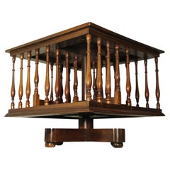 A Victorian English Antique Tabletop Revolving Bookcase With Turned Supports