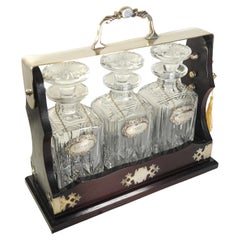 Edwardian Mahogany Tantalus With A Set of Three Cut Glass Decanters With Key