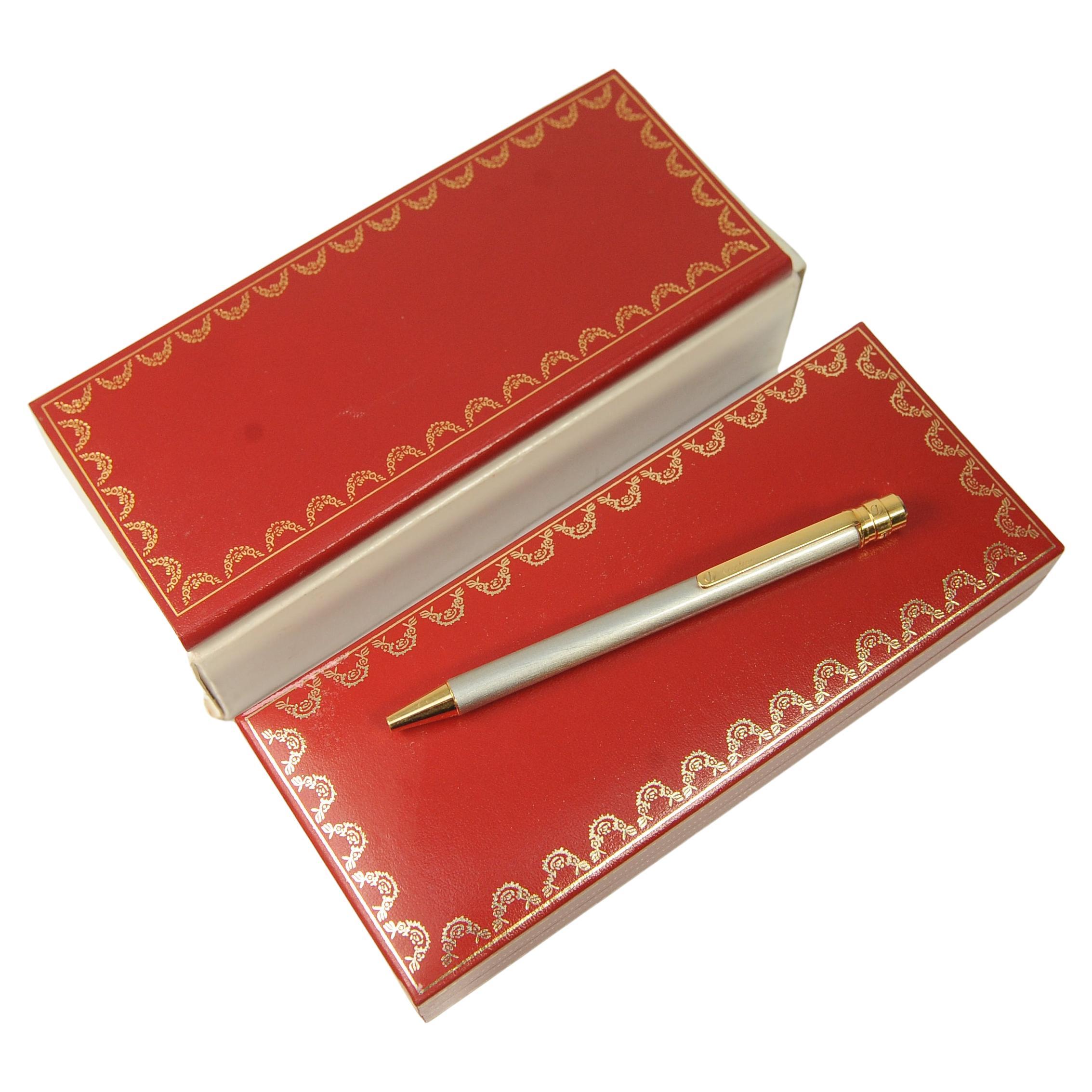 Cartier Brushed Steel & 18ct Gold Plated Stylo Bille Must II 
Comes With Original Paperwork & Red Cartier Presentation Box

2003, brought from Selfridges London

Cartier pens are designed by Cartier, & are manufactured by Montblanc. This