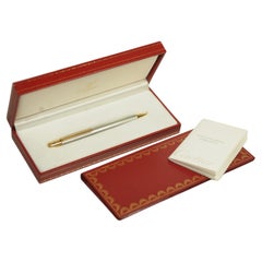 Bolígrafo Cartier de acero cepillado y chapado en oro 18 ct en caja original