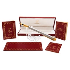 Stylo plume Must de Cartier Santos, plume en or 18 carats, acier brossé et métal doré