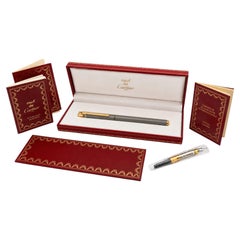 Stylo plume Must de Cartier Santos, plume en or 18 carats, acier brossé et métal doré