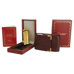 Raro accendino Godron placcato oro 18ct Cartier e portasigarette Cartier in pelle