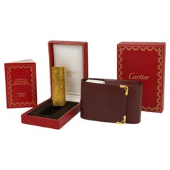 Accendino Cartier placcato in oro 18 carati e portasigarette Cartier in pelle bordeaux