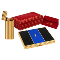 Briquet « Godron » Cartier plaqué or 18 carats, étui à cigarettes Yves Saint Laurent et boîtes