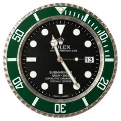 Horloge murale à quartz de style Submariner verte Rolex, modèle de présentation pour revendeurs, portant la mention « Rolex »