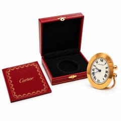 Reloj despertador de viaje Cartier, ovalado y dorado, en caja *Sin gastos de importación a EE. UU.*