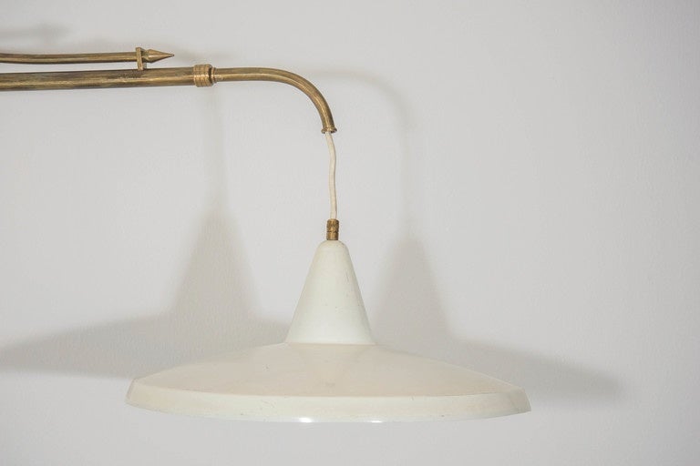 A wonderful wall sconce with a brass counterbalance that allows an adjustable drop of 10