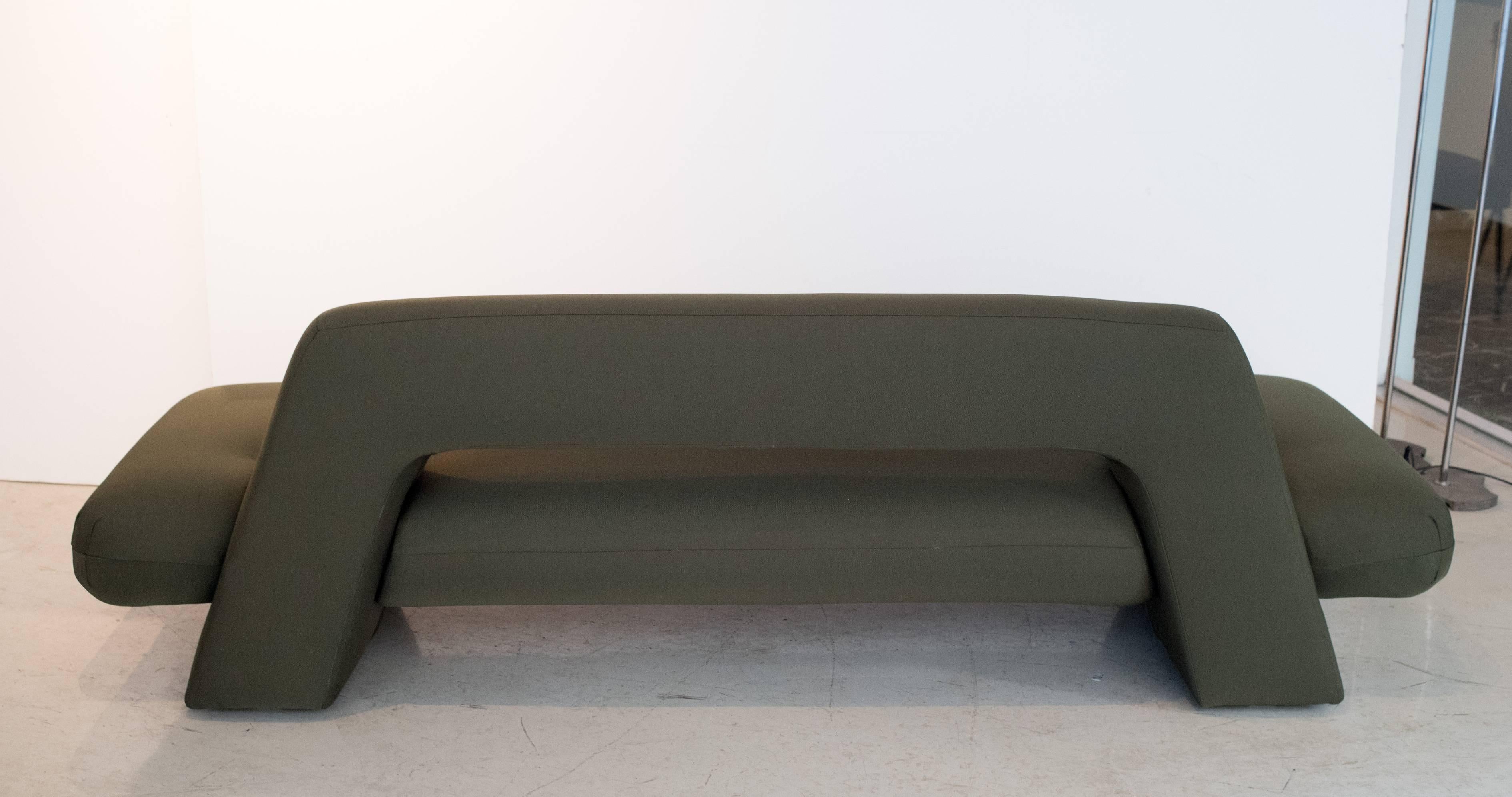 Clean, crisp lines are the trademark of this beautifully reupholstered Mayan sofa. The sofa is completely redone in a gorgeous olive fabric. The fabric has the most delicate subtle sheen to it. This is a vintage piece from 1983 that has been