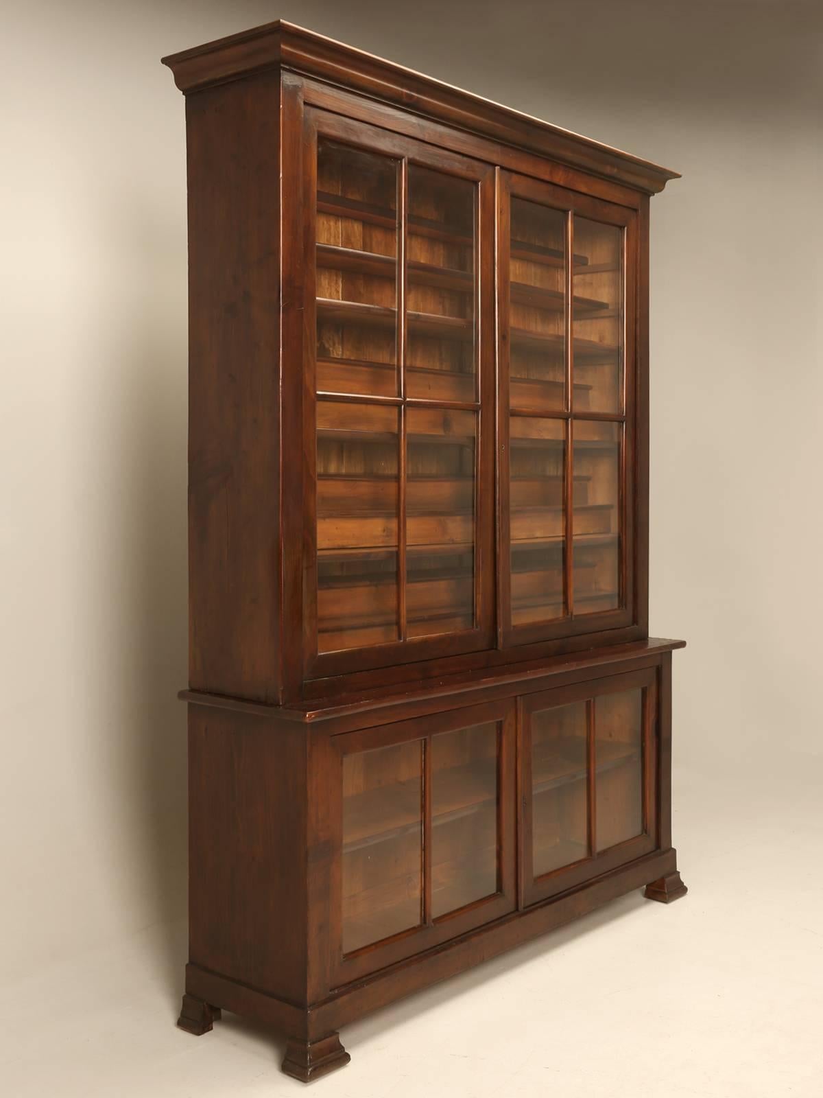 Antique French Bookcase or French China Cabinet that started out life in The Village of Varennes-sur-Allier that was the home of a Monastery built in 1891 named; Maison des Freres Maristes. In one of the classrooms stood a pair of immense Cabinets,