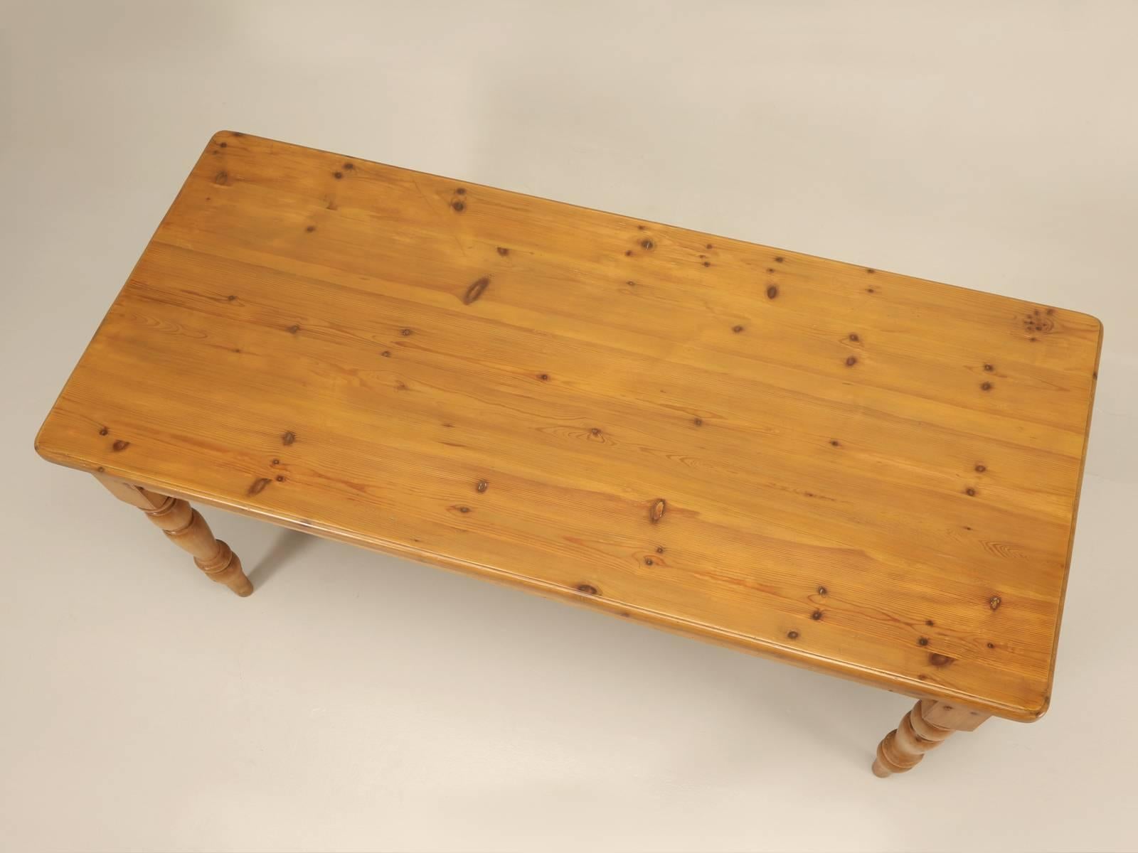 English pine reproduction farm table made about 25 years ago in the North of England and we just refinished it in our Old Plank workshop. When this was made, the end drawer was a useful option available for napkin storage. Nicely constructed from