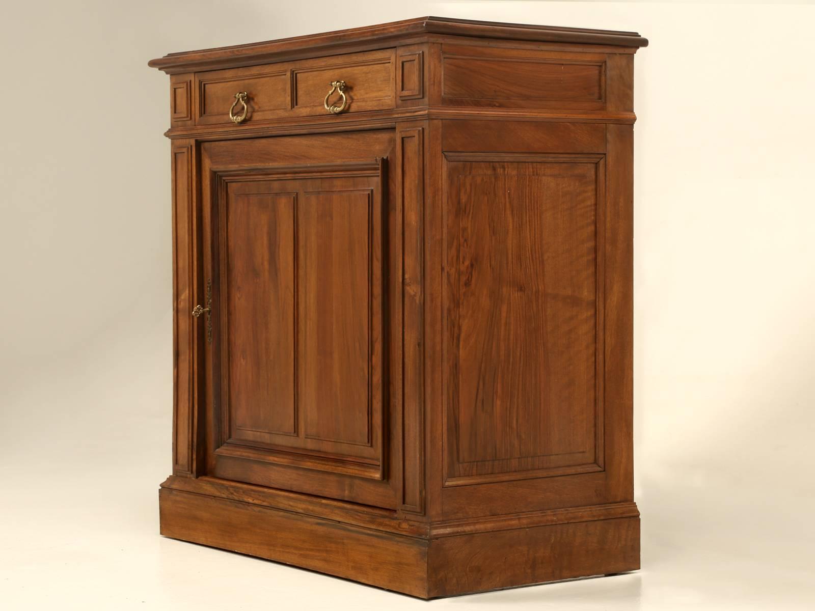 French walnut petite buffet or cupboard that would make for an excellent powder room vanity or just some extra storage in a tight quarter. Restored inside and out and requires nothing more before delivery. Please note we have one more just a smidge