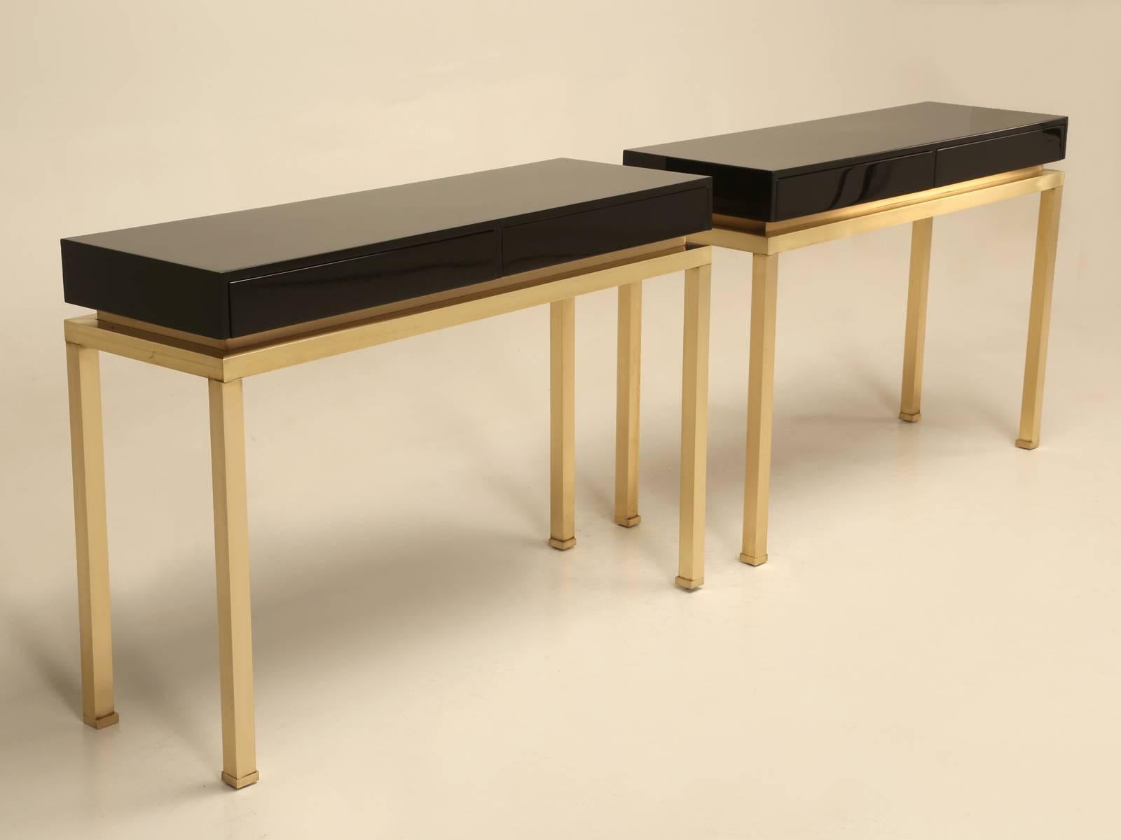 Designed by Guy Lefevre for Maison Jansen and probably produced in the early 1970s. Unusual for us to find a pair and especially so in a black lacquer finish, with no paint chips or surface scratches. The brushed solid brass bases are very nice and