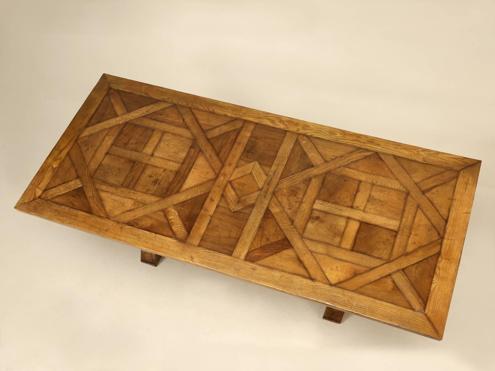 Parquet top trestle dining table, created in our Old Plank workshop, from old French floor panels and reclaimed wood imported from France. Each floor panel is carefully restored and the gaps from years of shrinkage have been filled with wood fillets