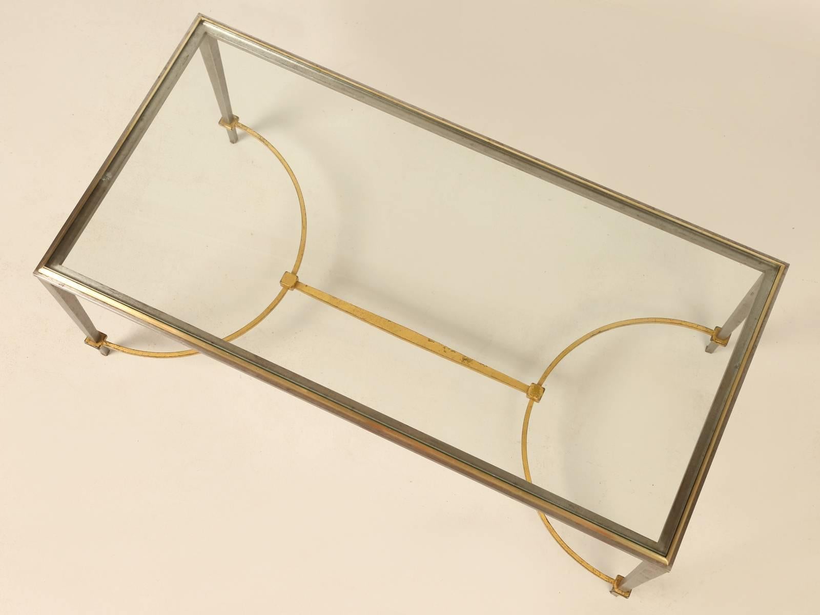 French Mid-Century coffee or cocktail table is the style of Maison Ramsey. The frame is made from gilded steel, burnished steel and solid brass and is extremely strong, which would allow for different top options. No previous repair of restoration