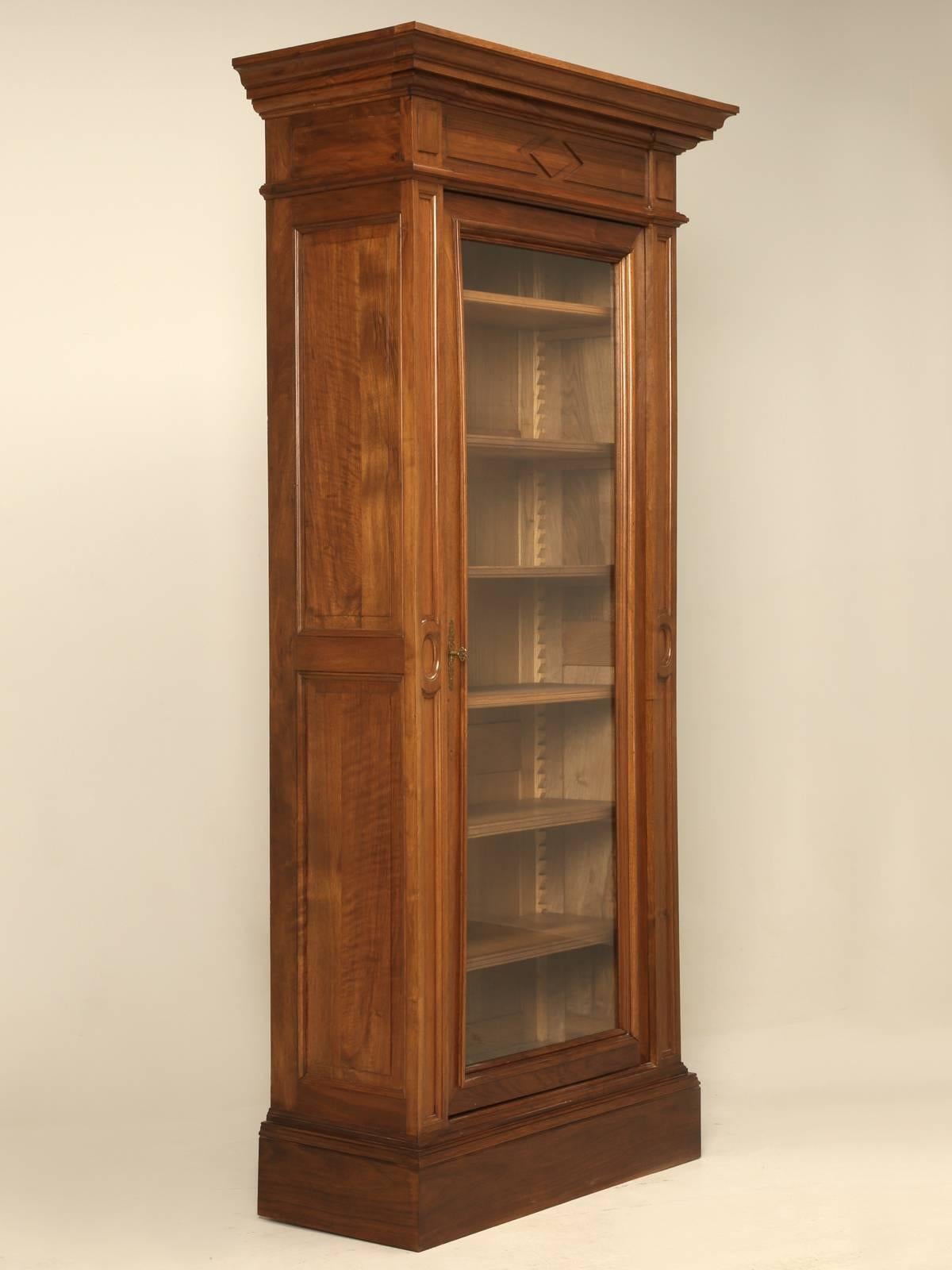 Unusually narrow for an antique French bookcase, or as they prefer to call it, a bibliotheque. Made from solid walnut around the turn of the century and was very well maintained and was actually so nice, that all we had to do was give it a thorough