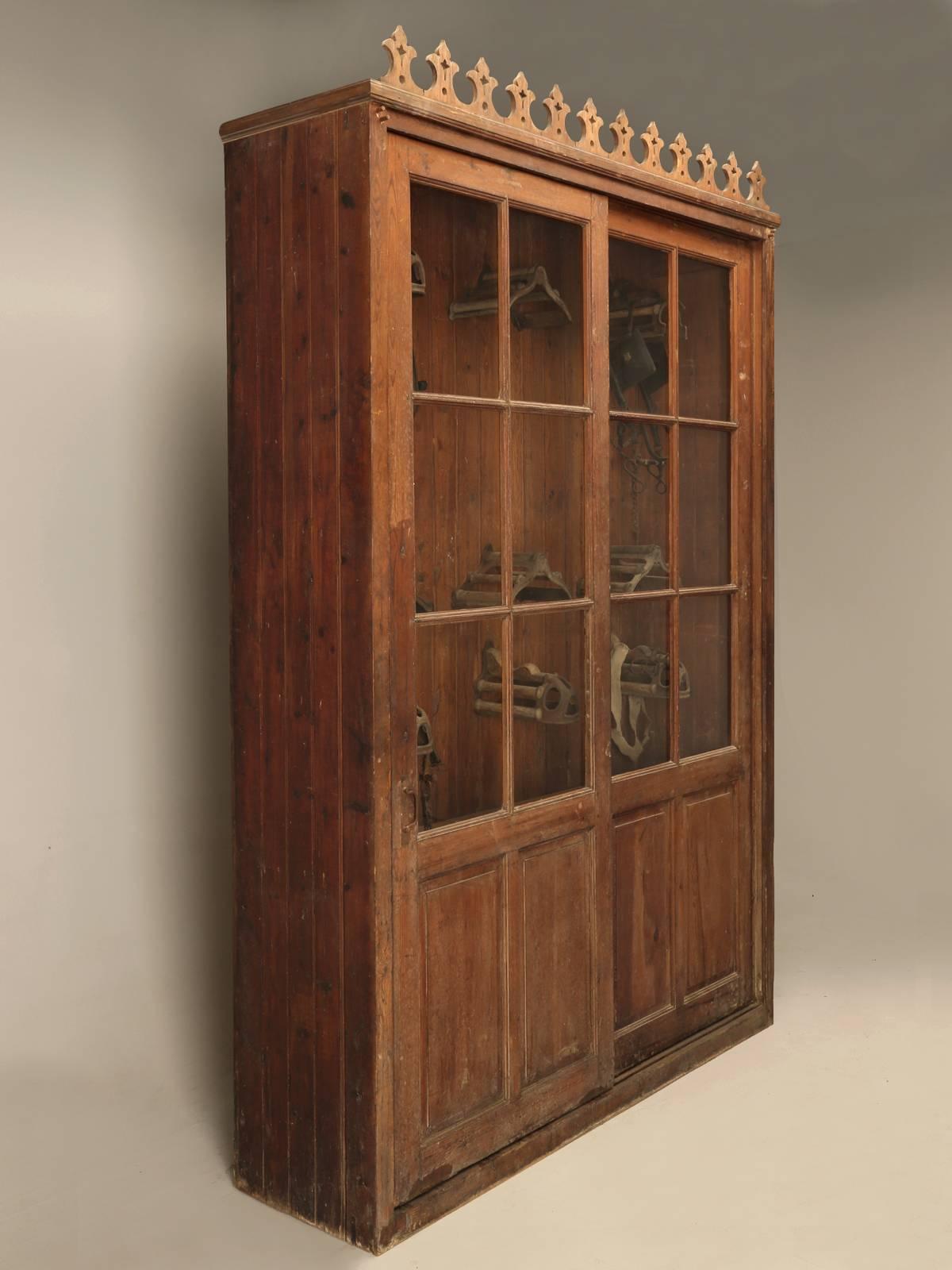Antique Fitted French Tack Cabinet from a vineyard in the South of France near the town of Bezier, circa 1880-1900. The sliding doors still have their handmade French wavy glass, and we have gone through an exhaustive sympathetic restoration, while