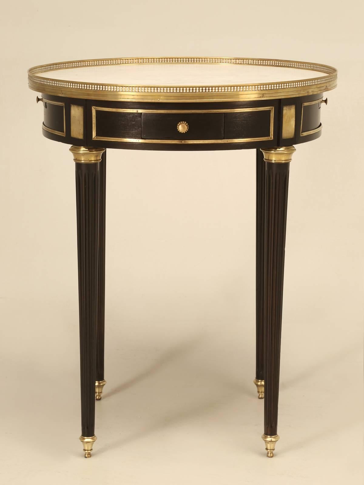 The most elegant side or occasional table that we have had for some time. Our Old Plank restoration department carefully hand sanded and stained the mahogany table in a beautiful and timely ebonized finish, complimented nicely against the brass