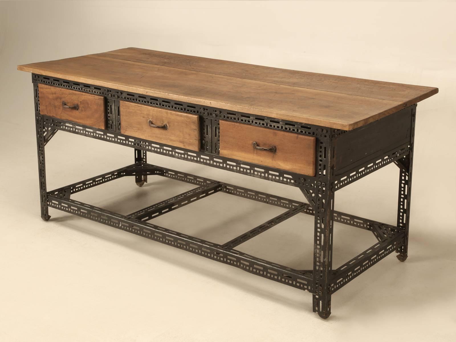 French Industrial steel and walnut factory table, with a beautiful two board top and three large and very functional drawers. We purposely left the walnut top in an as found condition, but it might make for a wonderful juxtaposition if we refinished