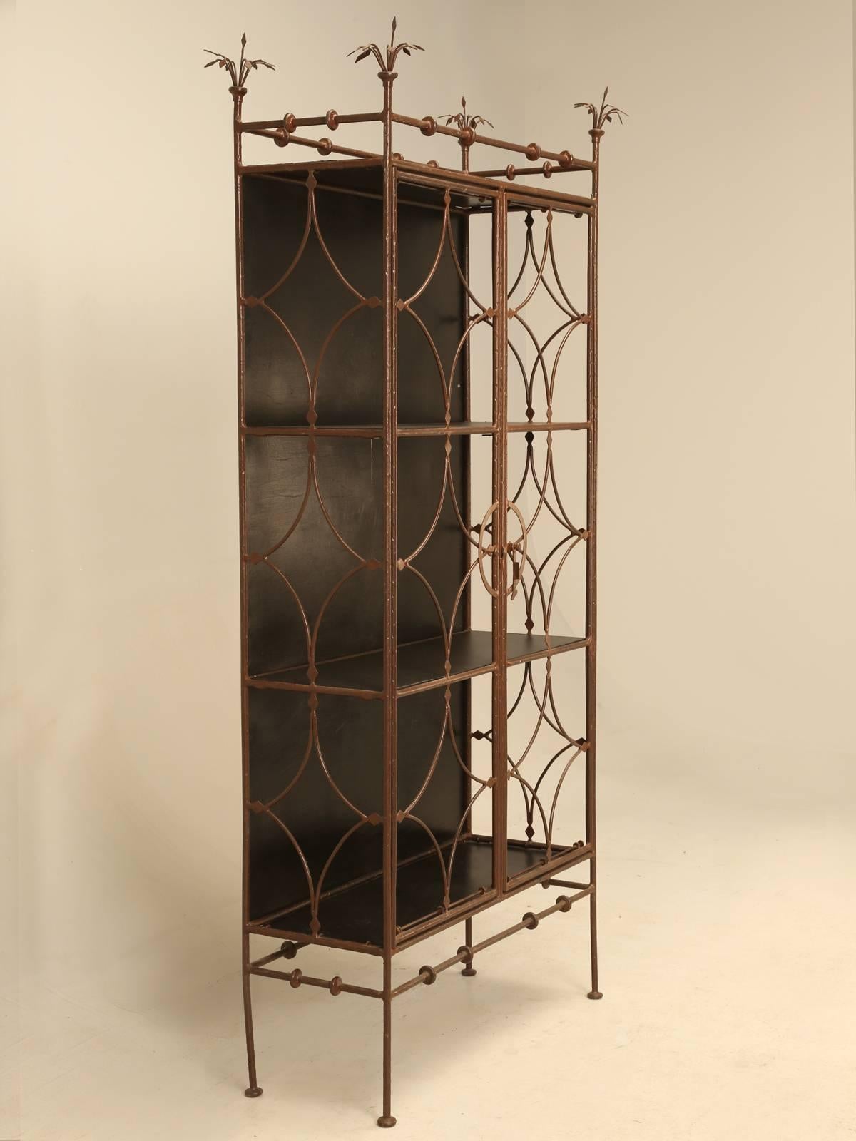 Very unusual metal bibliotheque (bookcase) or display piece. We purchased this in the town of Vannes, which is a medieval walled city in the Brittany region of France and is over 2000 years old. The antique dealer we purchased this from, stated that