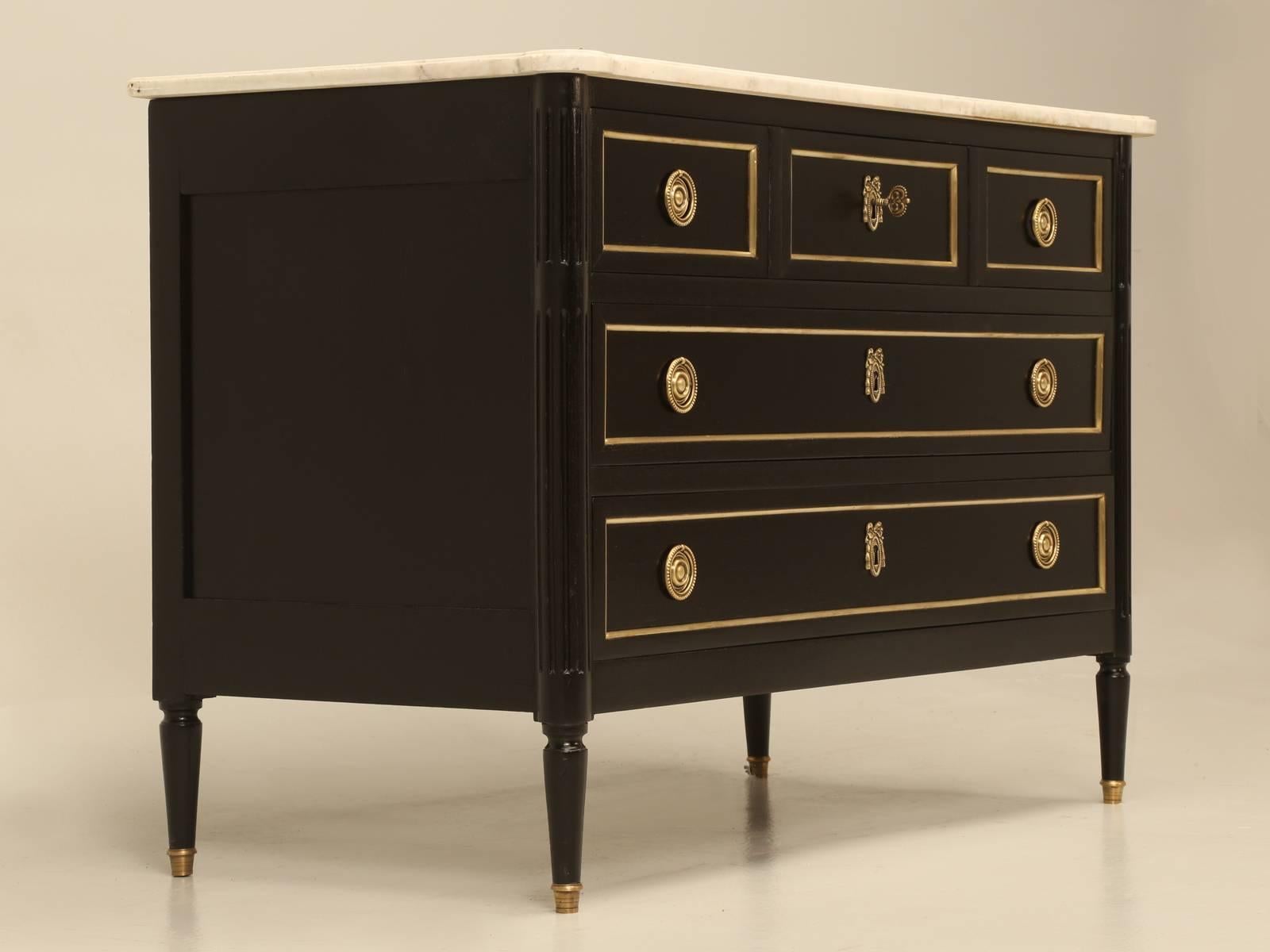 Antique turn-of-the-century Louis XVI style commode, that was completely hand-stripped without the use of chemicals and carefully ebonized with stains that still allow for the grain of the mahogany to show through. With the drawers being hand-dove