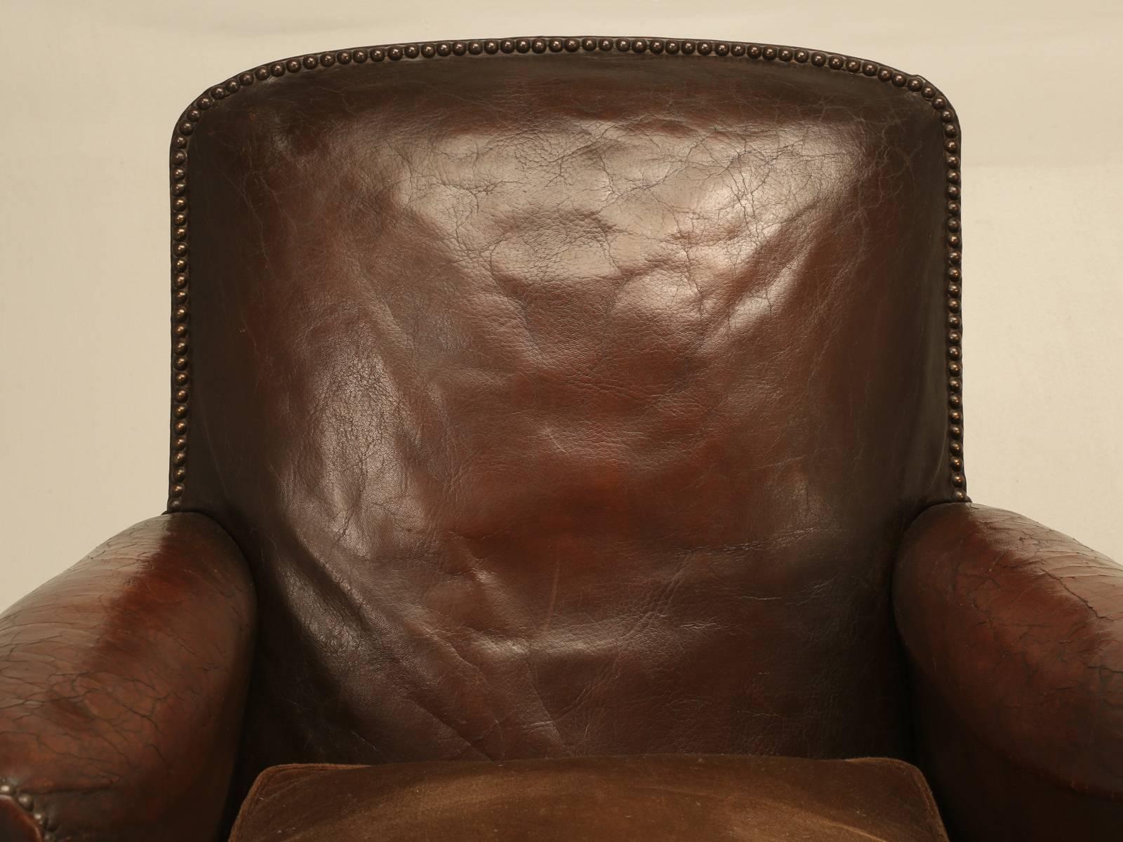 An exceptional pair of “all original leather” club chairs, that our Old Plank upholstery department thoroughly restored from the frame up, without managing to disturb the leather. The seat cushions were probably never covered in leather, like so