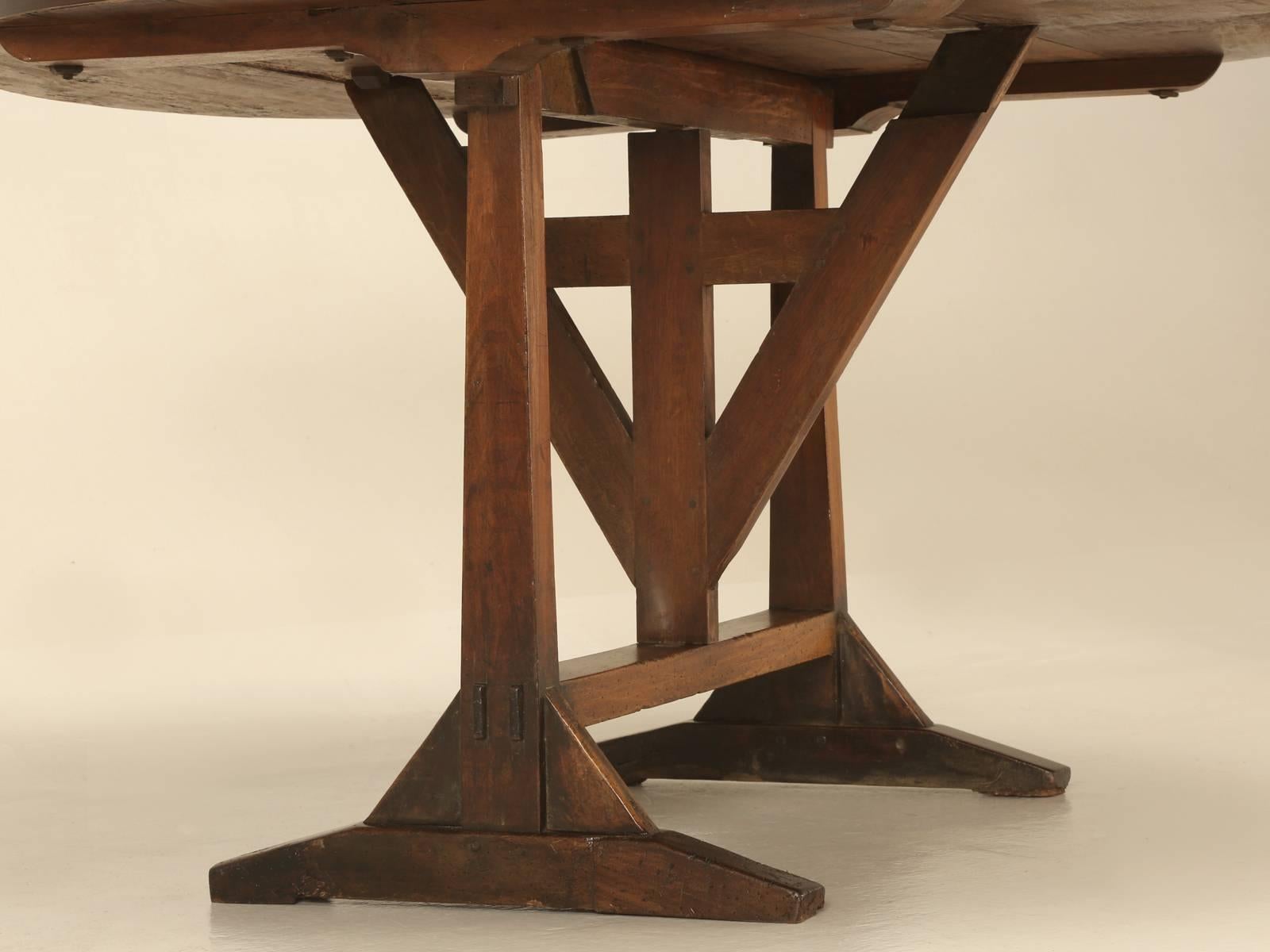 Over the last 25 years we probably have handled over 100 tilt-top wine tables and rarely are they ever made from solid walnut. We think the original intention of these tables were for the vineyard workers to use for lunch and they were folded up and