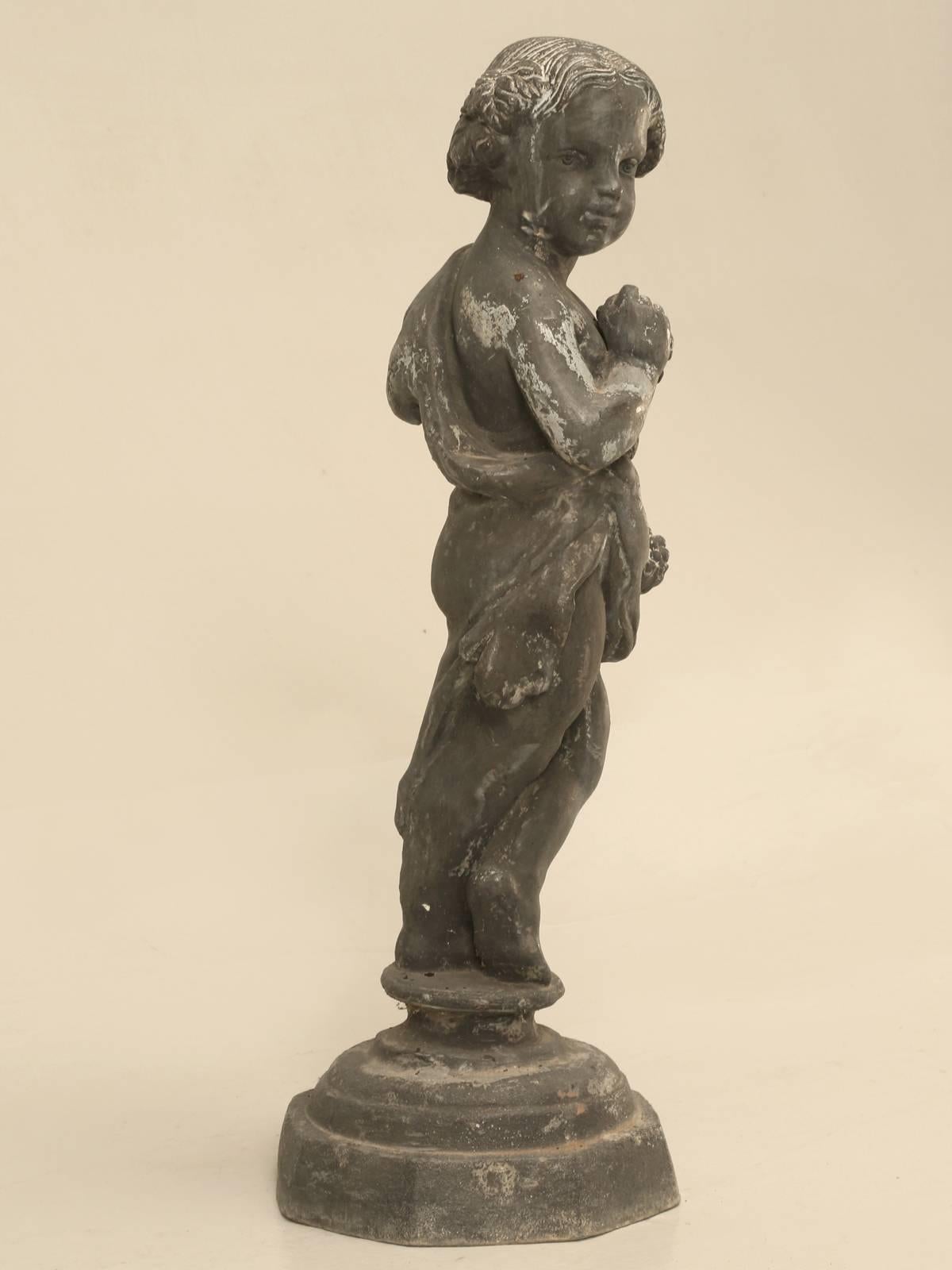 Lead garden statue that we have had in our garden for the last 15-20 years. My best guess is that the lead was cast in England and probably in the early 1900s, based on the patina and color of the lead.