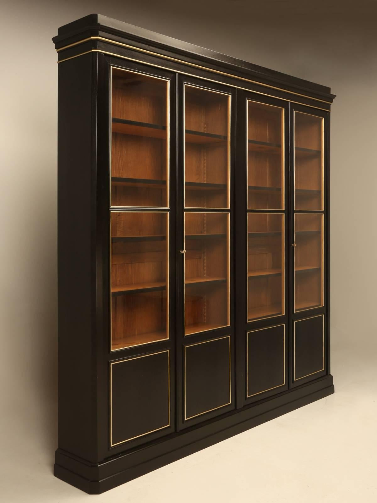 The French would call this a “Grande Bibliotheque” and that pretty much says it all. Our Old Plank restoration department, completely disassembled the entire bookcase and rebuilt every connecting joint, while still allowing for the cabinet to be