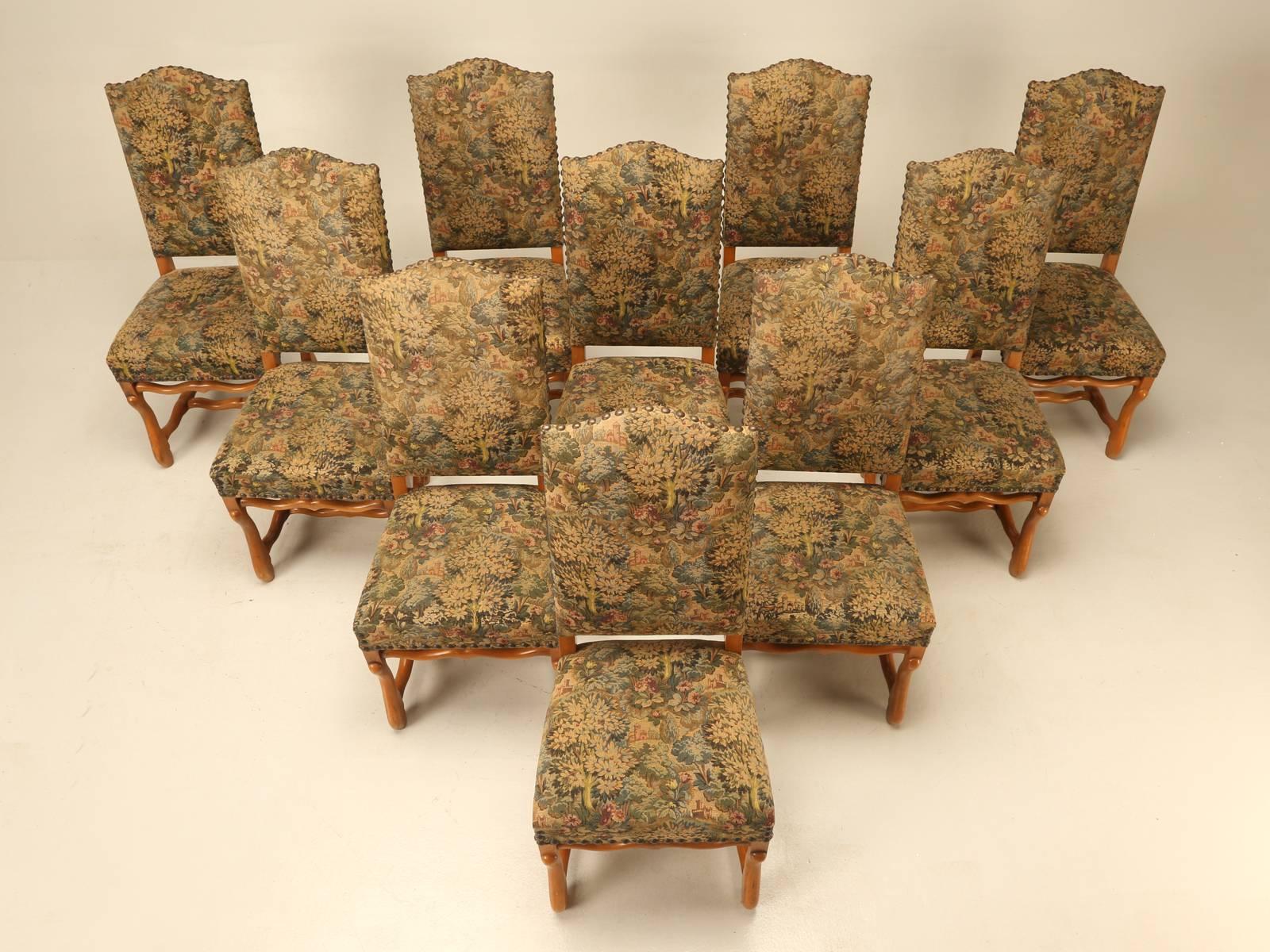 French vintage set of ten (10) dining chairs whose fabric needs replacing, but which are structurally very sound and priced accordingly. The style is typically called “os de mouton”, referring to the shape of the stretchers that are similar to a