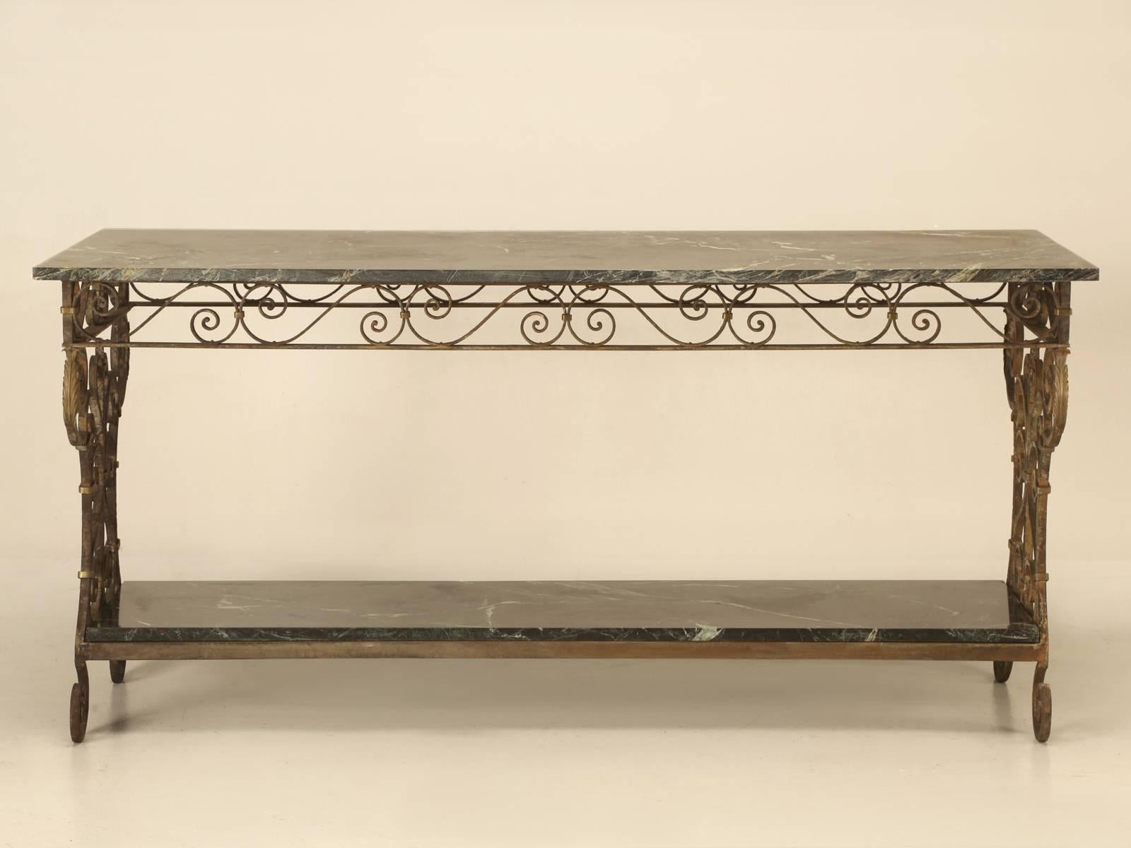 Although this marble and steel table appears to be either French or Italian, I believe it might actually be American and they were commonly used in greenhouses around the turn-of-the-century. We had used it as a sofa table for many years, but