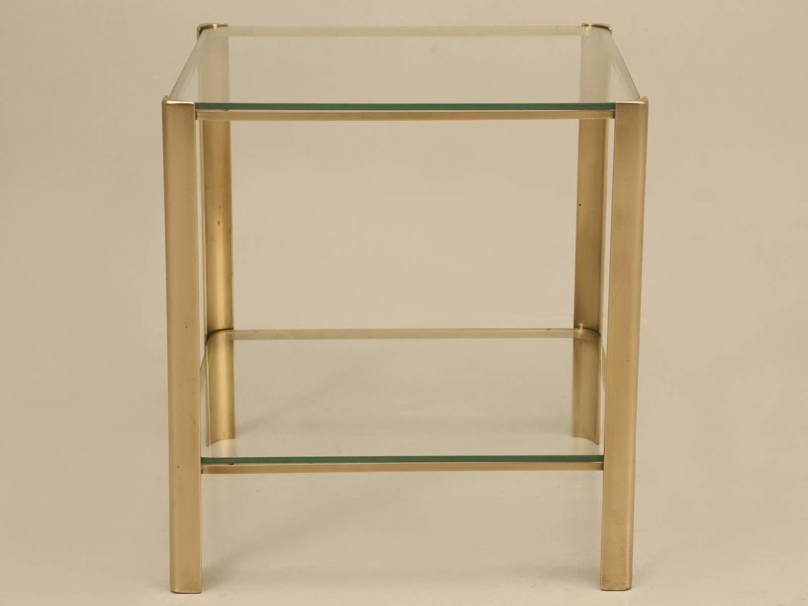 French Mid-Century Modern solid bronze end table with glass top, in a design that I have never seen before. Beautifully executed and there are no prior repairs. Generally, small end or side tables like this, would be made from brass, so to find a