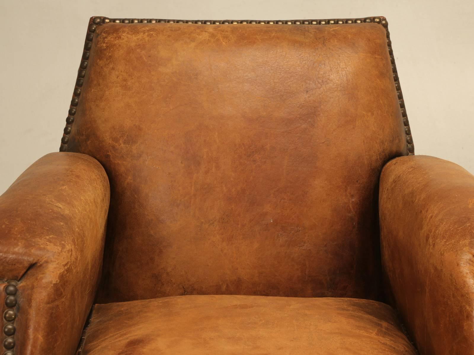This single French leather club chair is one of those extra deep; meaning super comfortable club chairs that are becoming more difficult to purchase in their original leather. Our Old Plank upholstery department completely disassembled the frame to