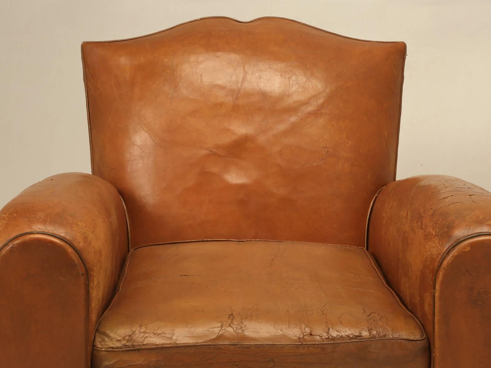 Although not exactly a pair of French leather club chairs, they have been together in the same house since new, from the city of Deauville, France a picturesque seaside town in Normandy. The leather is all original and since they were always a pair,