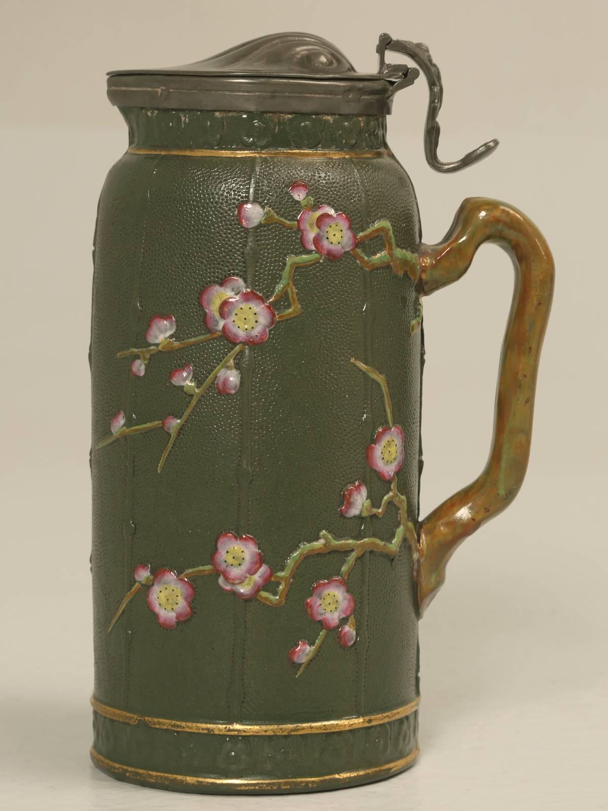 Antique English stafforshire pottery pitcher Chinese Chippendale (Choissong) style with a pewter lid. There are no cracks, nor any prior repairs and other than the patina on the pewter, looks almost flawless.