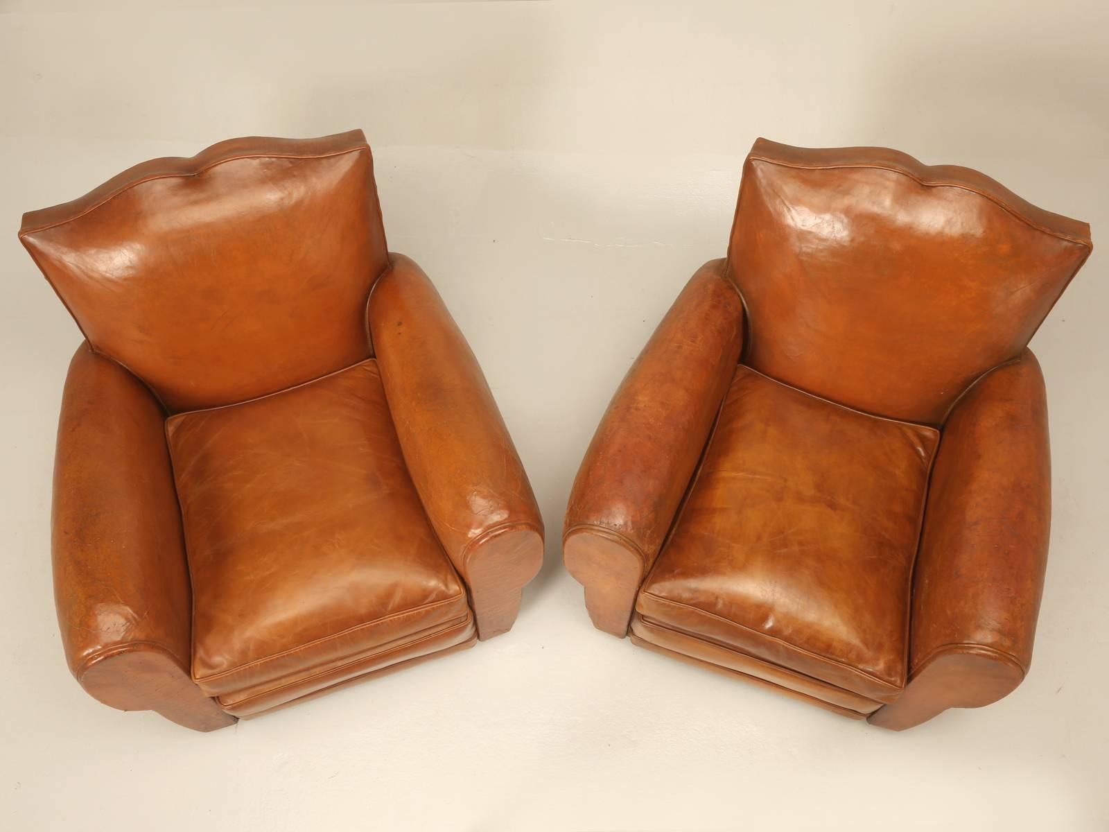 Mid-20th Century French Art Deco Moustache Back Leather Club Chairs with one ottoman 