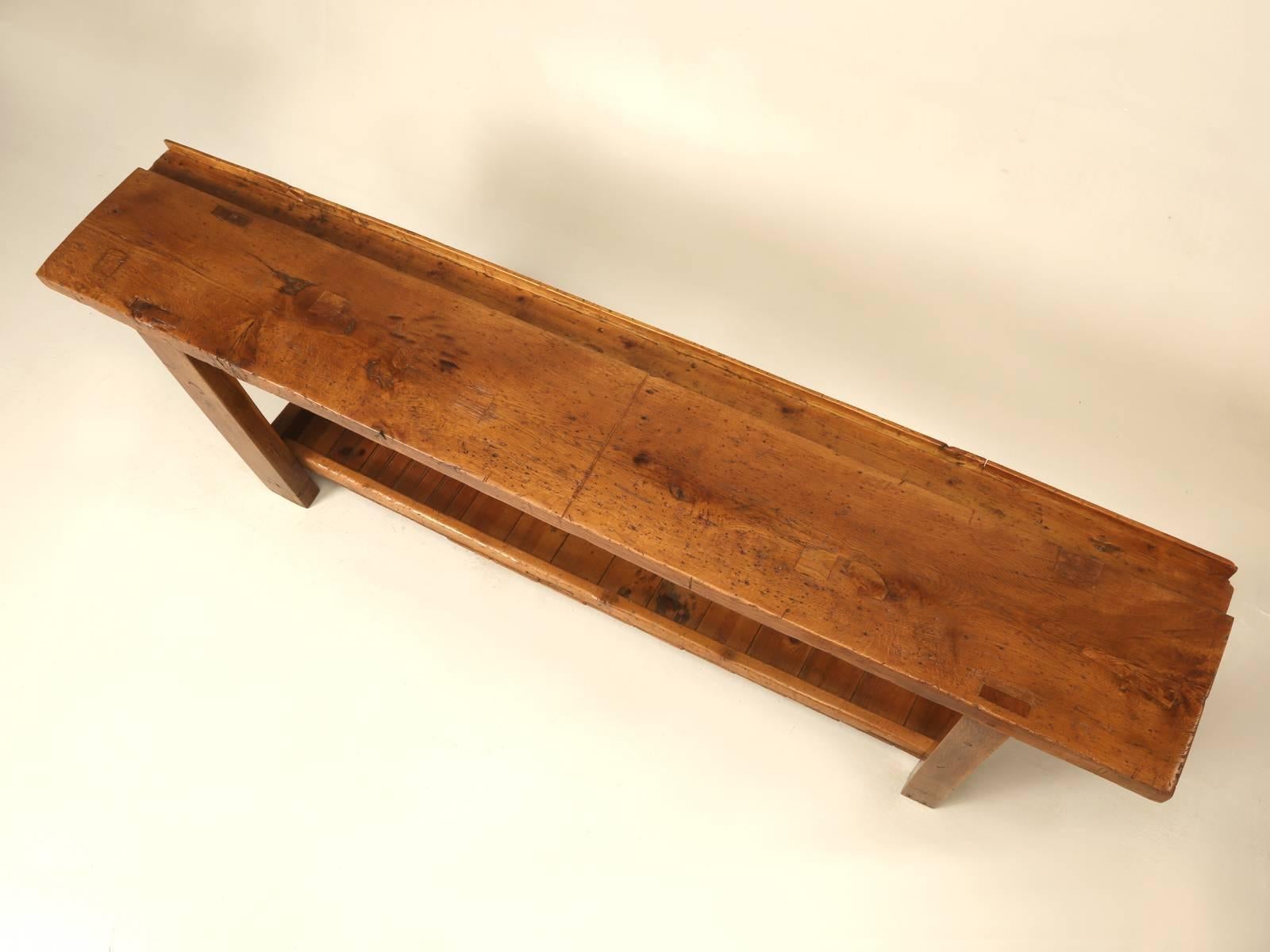 This is an old French carpenter’s table pulled from a closed down woodworking shop in the outskirts of Toulouse, France. Our Old Plank restoration department completely restored the table, filling all the old holes with wooden dowels and doing