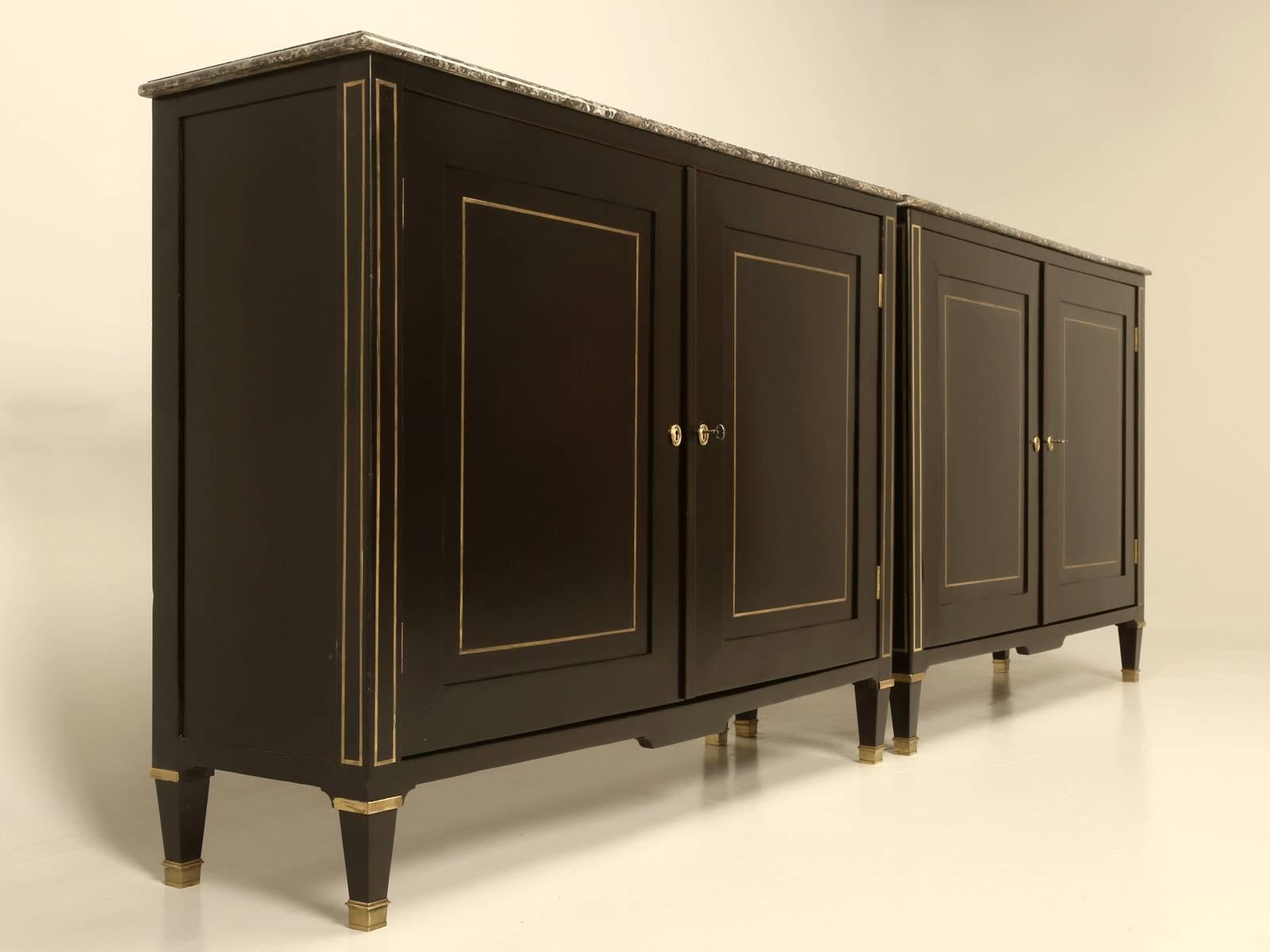We were just sitting here, trying to remember the last time we had a genuine pair of matching Antique French Buffets, lets alone Directoire style French Buffets and in 25 years, we believe this is the only pair we have ever had for sale. The pair of