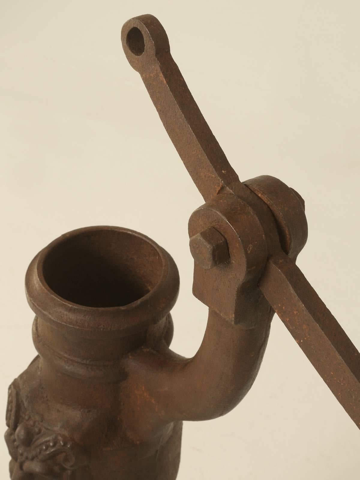 Antique French water pump from the early 1800s which would make for a great water fountain. The pump is cast from iron and will last forever in any climate. We have several listed on 1stdibs for sale and all came from a retired French antique dealer