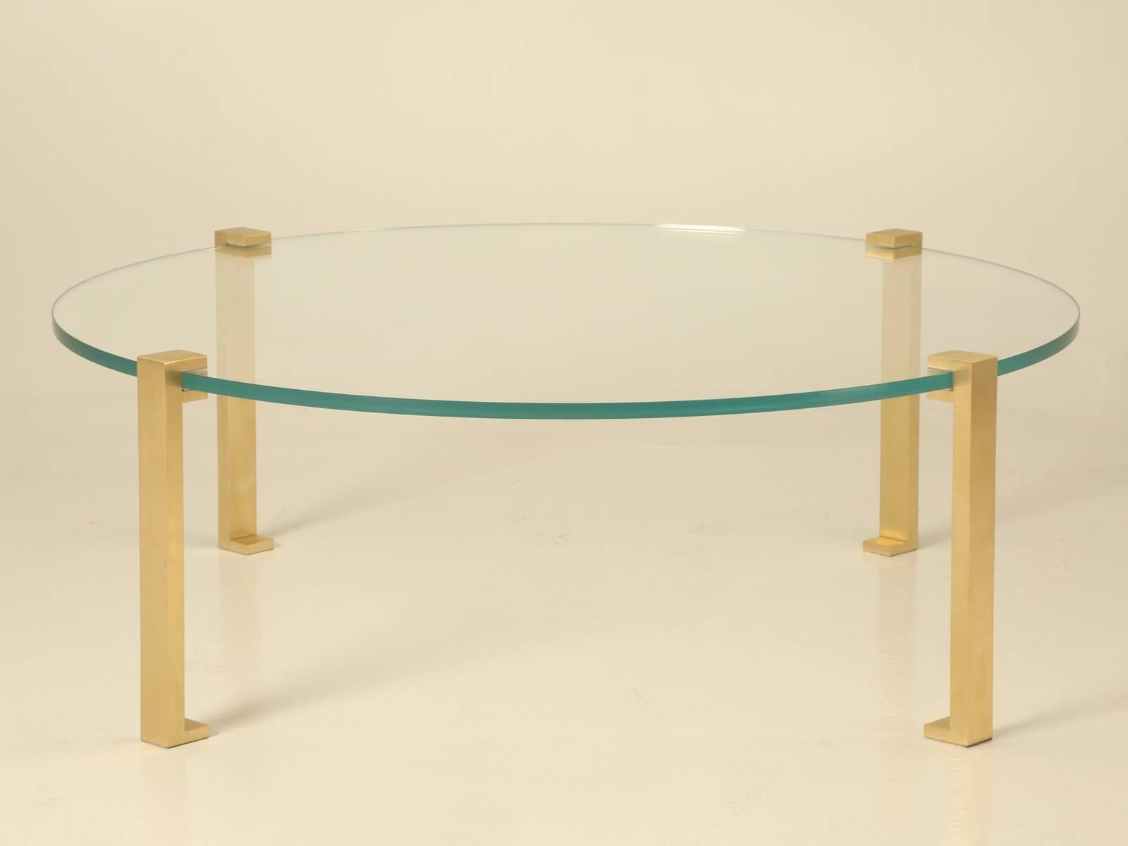 Mid-Century Modern coffee table that we manufacture in any diameter you chose and although this one has solid polished brass legs, optionally, you could spec; bronze, chrome, stainless or nickel. The table shown is 51” in diameter and was made with