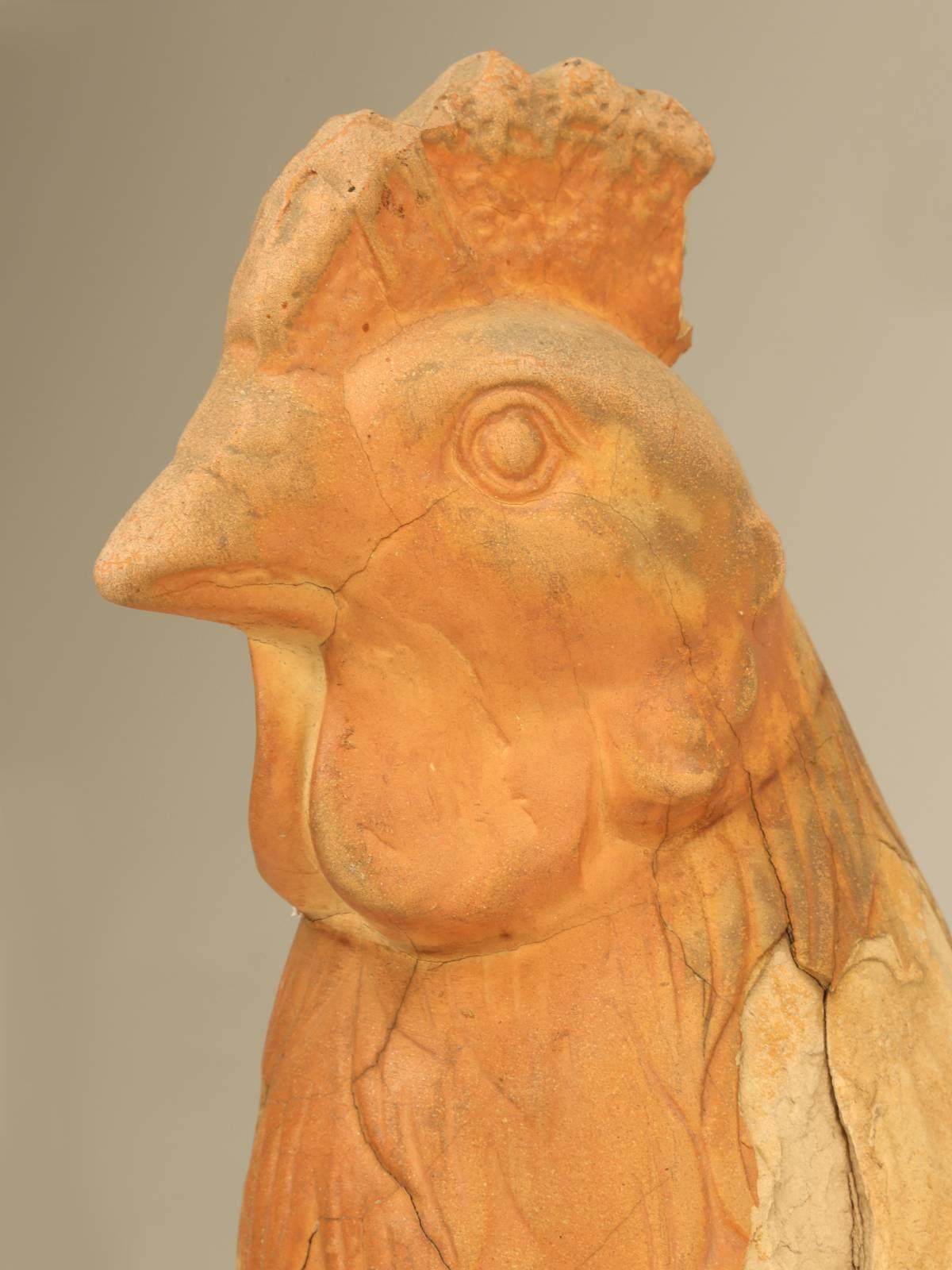 French terra cotta rooster, found sitting outside a closed factory where they originally made. We have several in stock and based on their condition I assume they were rejects and could really use a good home.