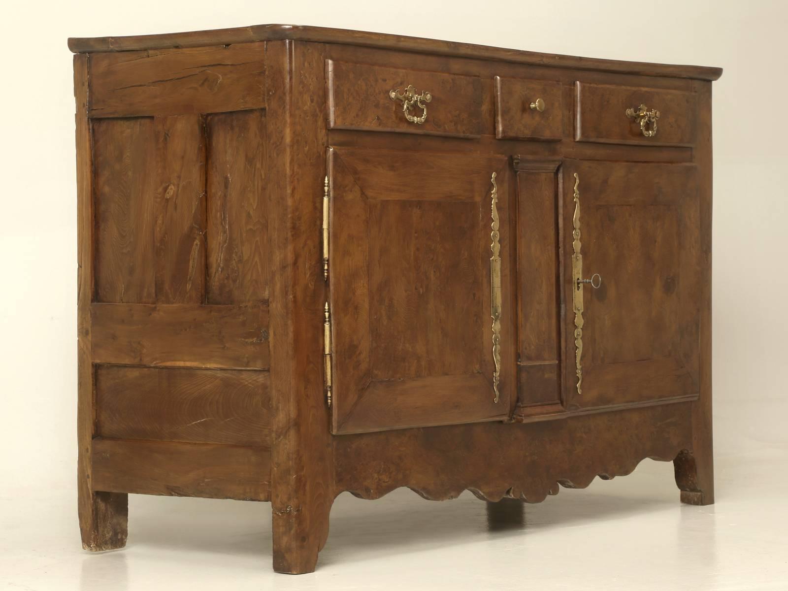 Beautiful and extremely unusual Antique “yew wood” French Louis XIII Style Buffet, with marvelous original escutcheons and in a gorgeous warm walnut color. The left-hand door is held in place with the original interior hand-forged hook. This Antique