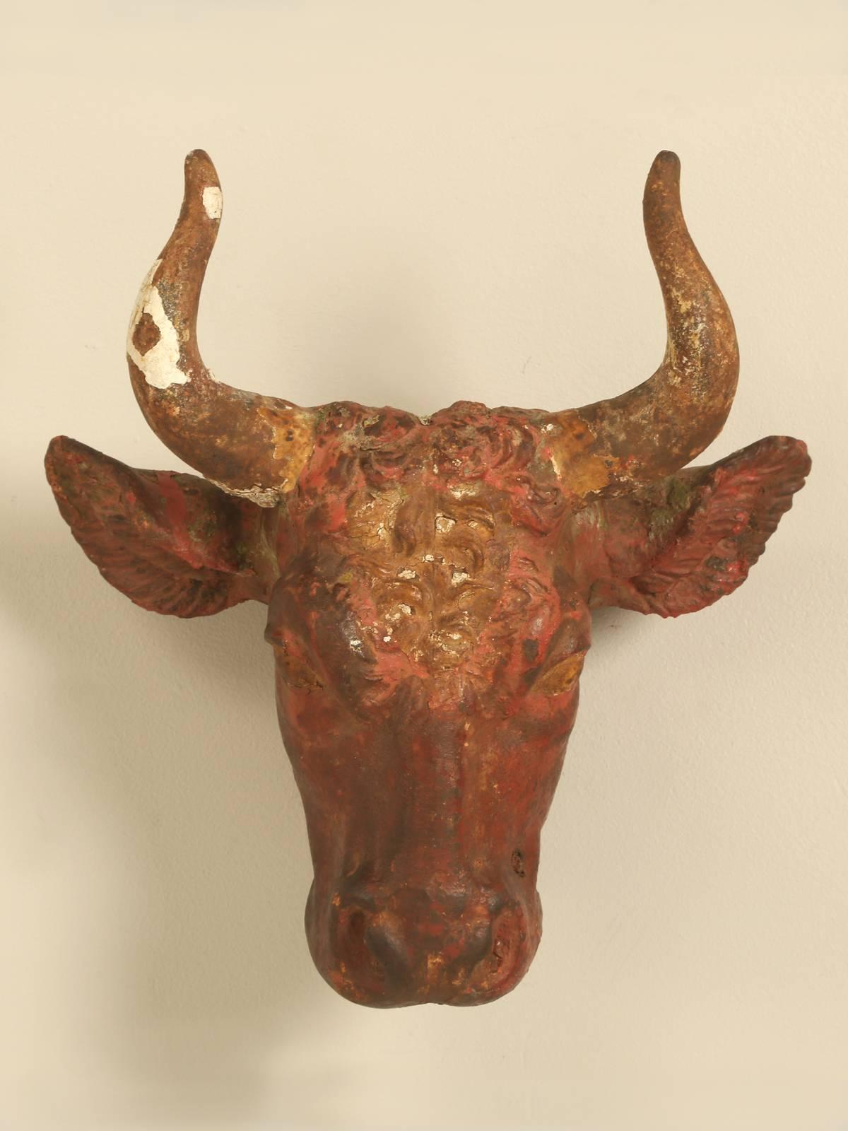 Antique French cast iron steer head, that was most likely used on the exterior of a butcher shop, or the French would call it a boucherie. We have been purchasing artifacts and accessories for Country French Kitchens, for over 25 years and this