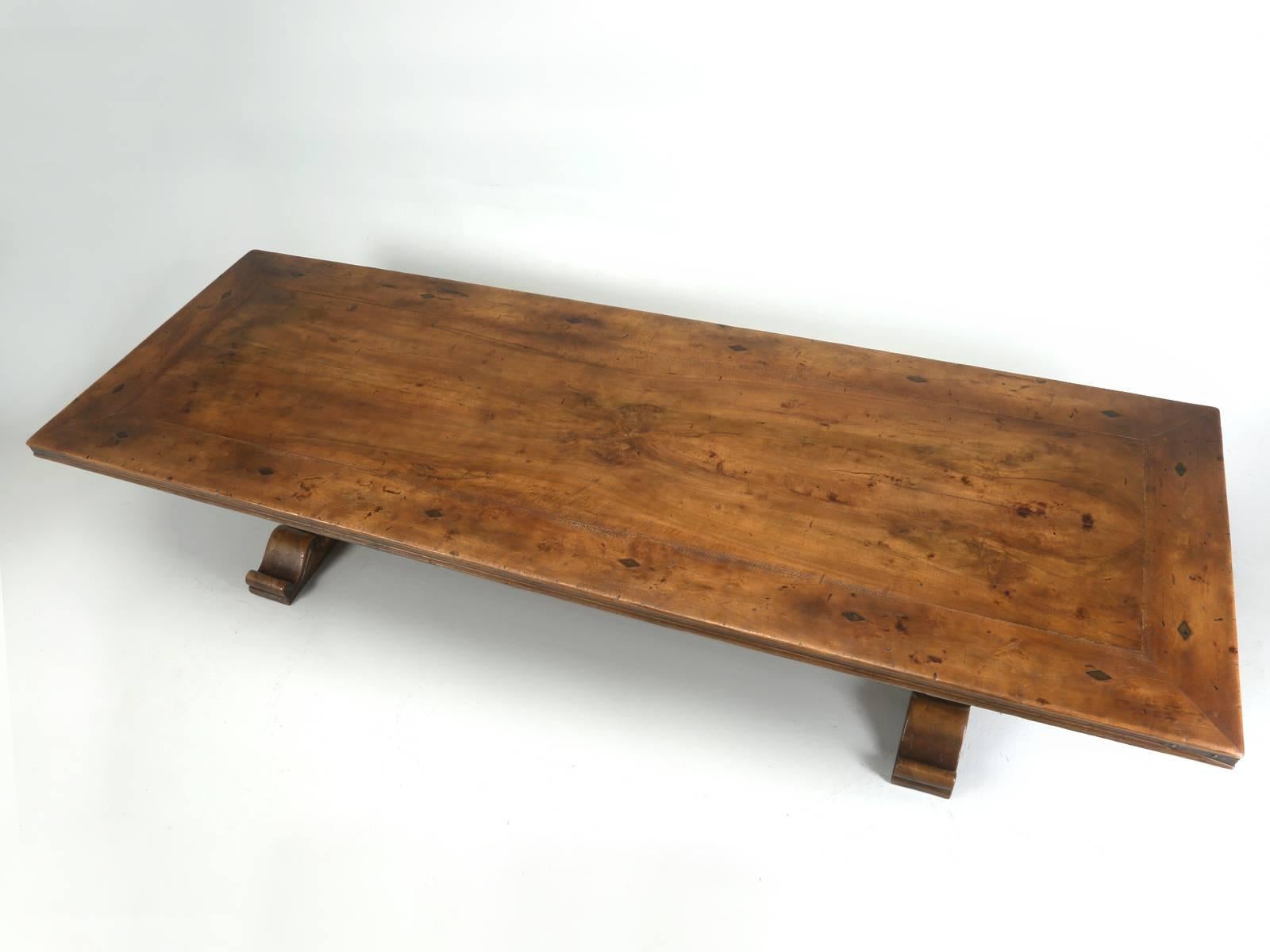 Country French walnut dining table, handmade by Henri Quinta and Company in the 1990s. Without a doubt, Quinta French dining tables, are some of the most famous in all of Europe and are noted for their incredible quality. Hate to admit it, but our