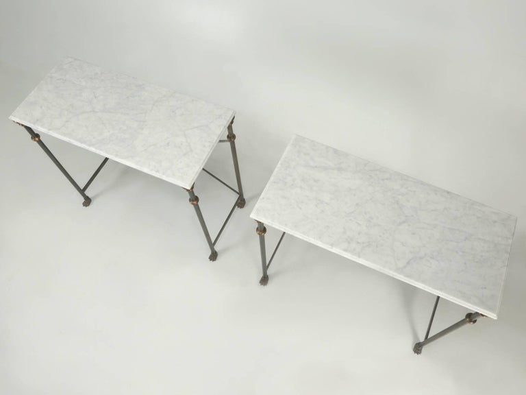 Matched pair of Old Plank console tables handmade in Chicago from Carrera marble, stainless steel with solid bronze fittings. These are part of our exclusive Old Plank Collection and can be made in any size and many other materials with optional